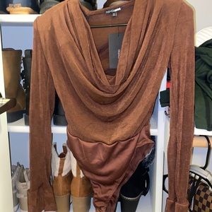 Fashionnova bodysuit, it has shoulder pads to give the dip alittle more depth.